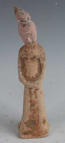 * A Chinese pottery figure, modelled as a female in standing...