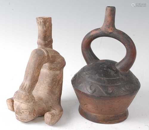 * A pottery stirrup vessel, modelled as a male figure, the h...