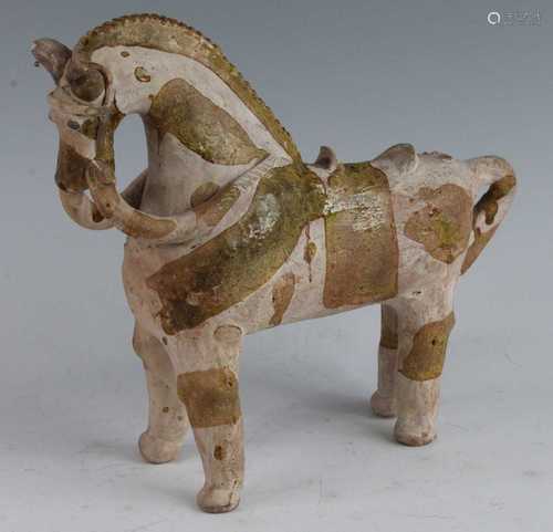 * An unusual splash glazed terracotta model of a horse in st...