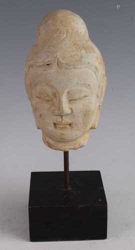 * A Chinese carved marble head of the Buddha, on a later cus...