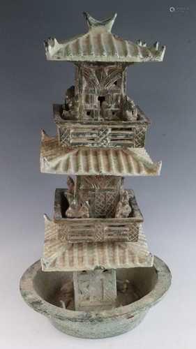 * A Chinese glazed pottery three tier sectional model of a p...