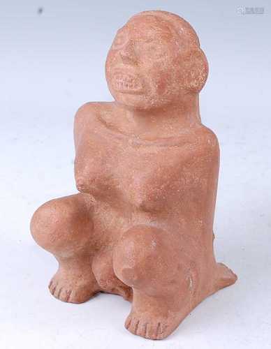 A hollow cast terracotta figure, modelled as a female in squ...