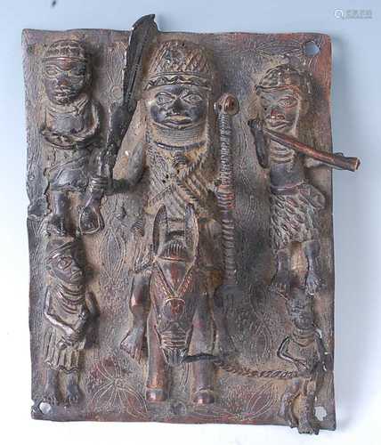 * A cast copper alloy panel, decorated in relief with Oba (K...