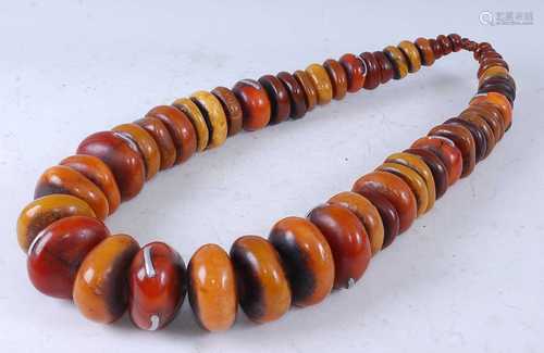 A large Berber amber Copal necklace, strung as fifty three g...