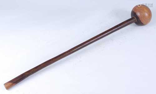 A South African iron wood knobkerrie, having a typical spher...