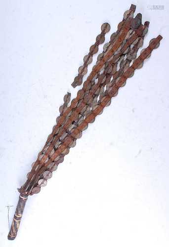 A West African whip/fly whisk, having eight leather tongs ea...