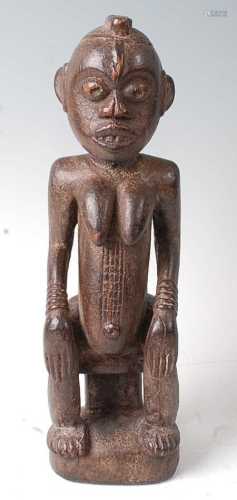 * A seated ancestor figure, Baule People, Ivory Coast, mid 2...