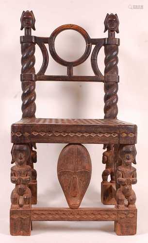 * A prestige chair, carved from indigenous hardwood, the bac...