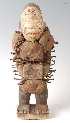 * An Nkisi nail fetish figure, having a polychrome painted f...