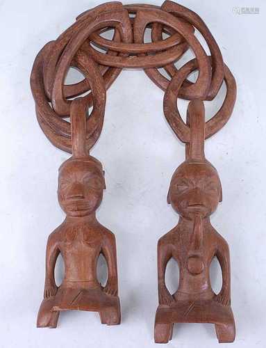 A pair of carved wooden Eden figures, each in the form of a ...