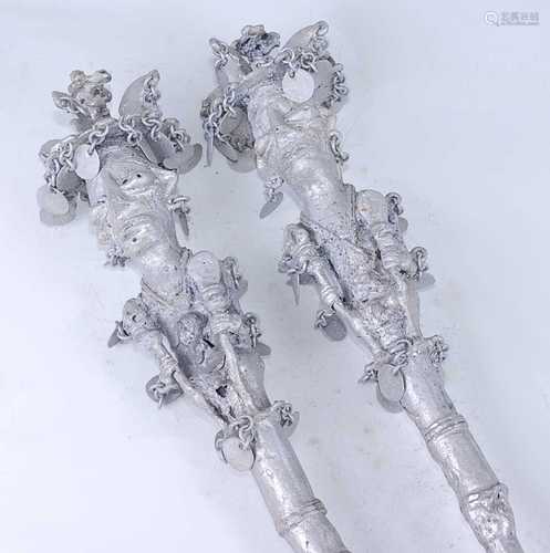 A pair of cast aluminium prestige style staffs, each tip in ...