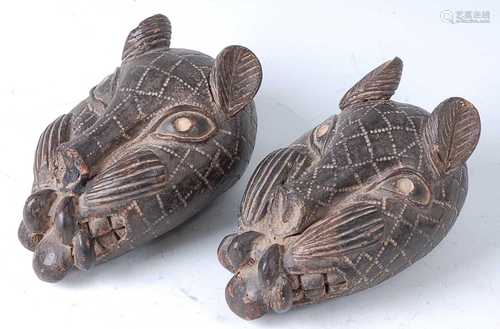 * A pair of terracotta Leopards heads, each naturalistically...