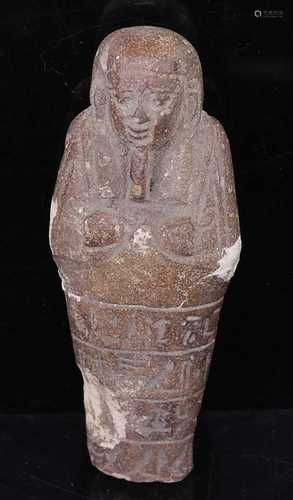 An Egyptian limestone shabti fragment, carved in typical sta...