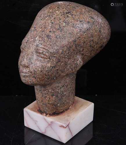 An Egyptian Aswan granite head of a Pharoah, styled in the m...