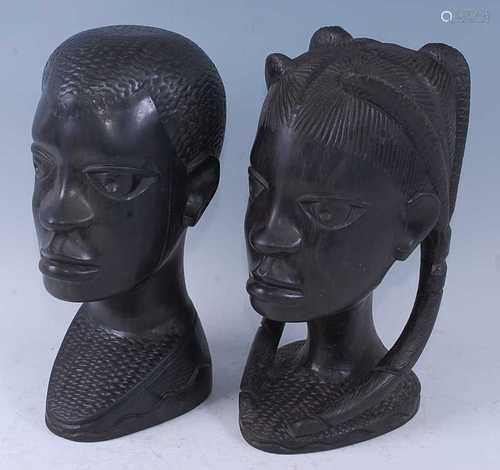 A pair of East African ebony busts, carved as a male and fem...