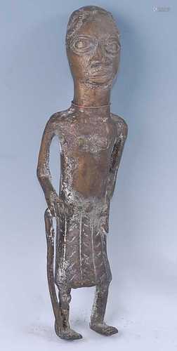 A cast brass elder figure, modelled in standing pose with st...