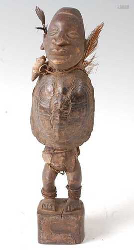 * A Nkisi Power fetish figure, having a carved wooden head w...