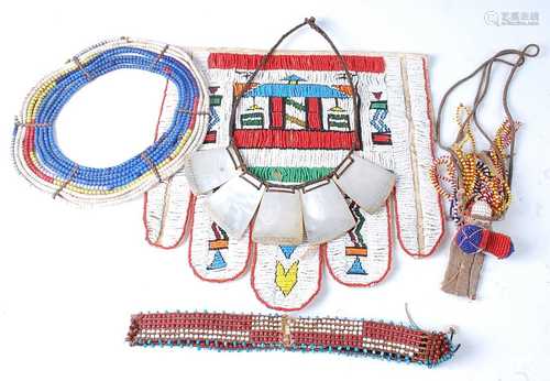 * A leather apron with applied beadwork decoration, depictin...