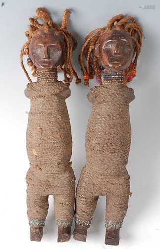 * A pair of Power fetish figures, each being woven bound and...