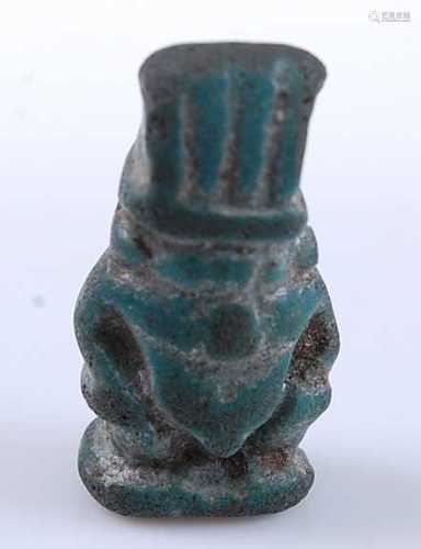 An Egyptian amulet bead, possibly depicting the Goddess Bast...