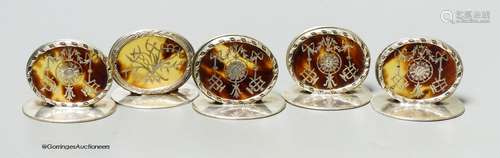 A set of four Edwardian silver and tortoiseshell pique oval ...