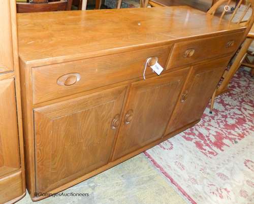 An Ercol elm Windsor sideboard, length 136cm, depth 46cm, he...