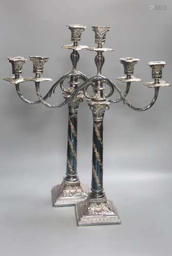 A pair of Georgian style plated two-branch three-light cande...