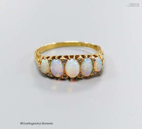 An Edwardian 18ct gold and graduated white opal set half hoo...