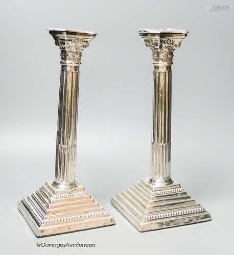 A pair of 1960's silver Corinthian column candlesticks, D J ...