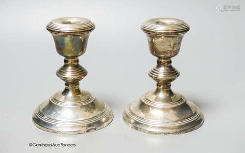 A modern pair of silver mounted dwarf candlesticks, Birmingh...