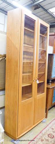 An Ercol Windsor elm two door display cabinet, width 91cm, d...