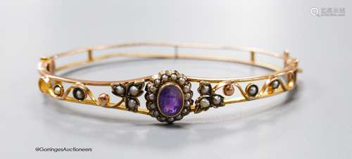 An Edwardian 9ct, amethyst and seed pearl cluster set hinged...