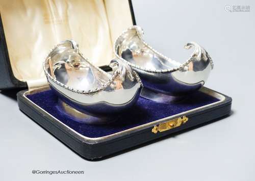 A cased pair of George V silver boat shaped bonbon dishes, S...