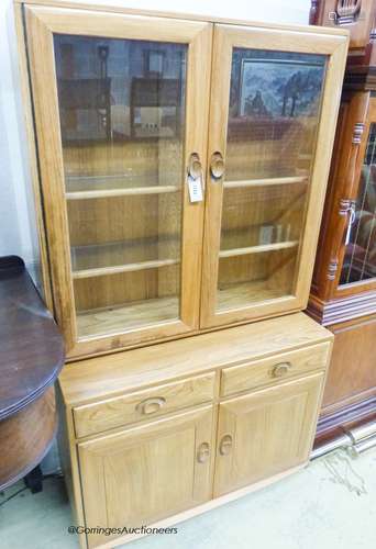 An Ercol elm Windsor glazed display cabinet, width 91cm, dep...