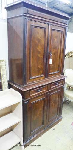 A late 19th century French rosewood two part cupboard with t...