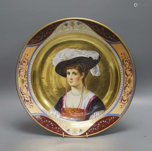 A 19th century Dresden porcelain charger, painted with a por...