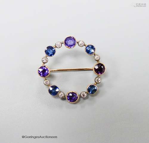 An early 20th century yellow metal, amethyst, sapphire and d...