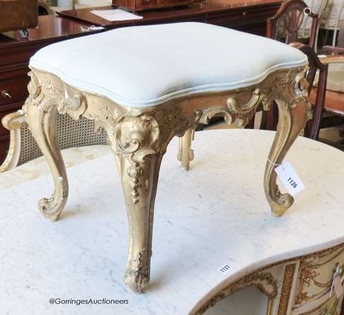 A Louis XV style carved giltwood and gesso dressing stool, w...