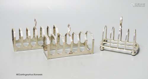 A pair of silver toast racks, Sheffield, 1950, 11.3cm and on...