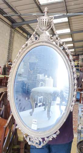 A Victorian oval giltwood and gesso wall mirror, width 56cm,...