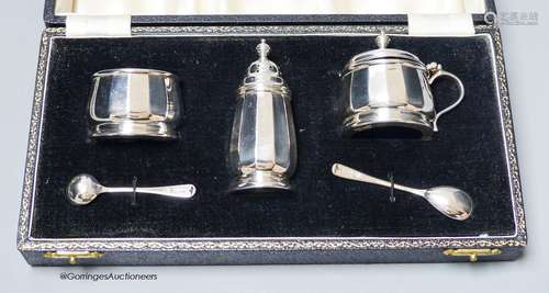 A cased modern silver three piece condiment set, with two sp...