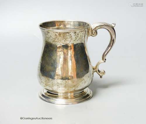 A George II silver baluster mug, with acanthus leaf capped h...