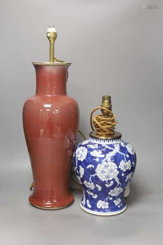 A large Chinese sang de boeuf lamp base and a similar blue a...