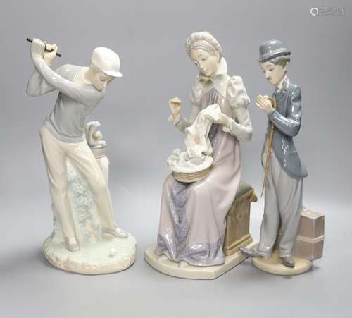 Three Lladro figures: a golfer, Charlie Chaplin and a lady s...