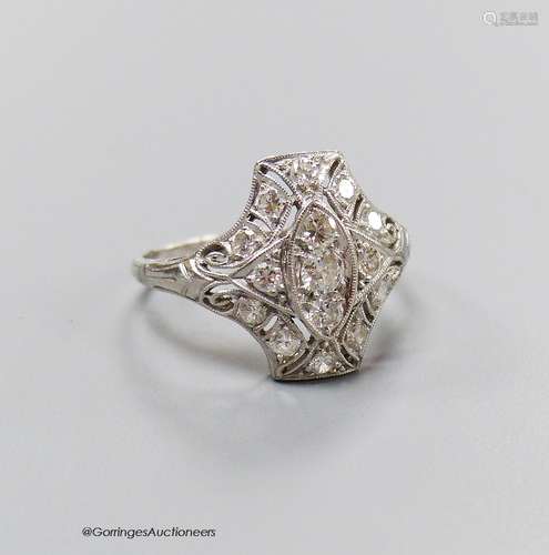 A 1920's pierced white metal and diamond cluster dress ring,...