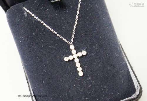 A modern Tiffany & Co platinum and diamond set cross pendant...