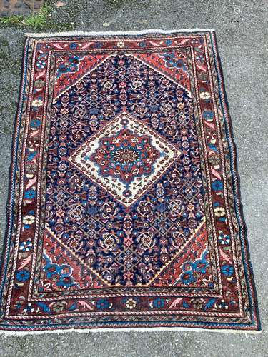 A Caucasian brick red ground rug, 150 x 108cm