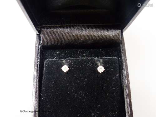 A modern pair of 18ct white gold and solitaire diamond set e...