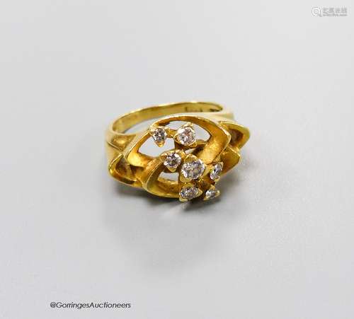 A 1970's? 18ct gold and seven stone diamond set modernist ri...