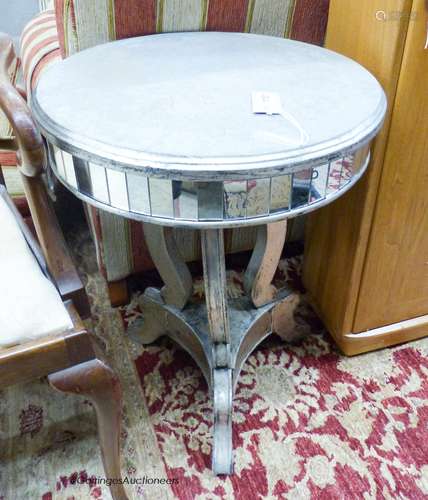 A circular mirrored occasional table, 48cm diameter, height ...